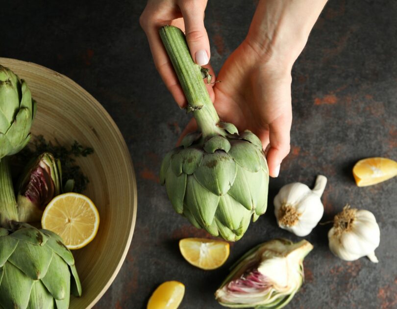 Concept of healthy food with artichoke plant