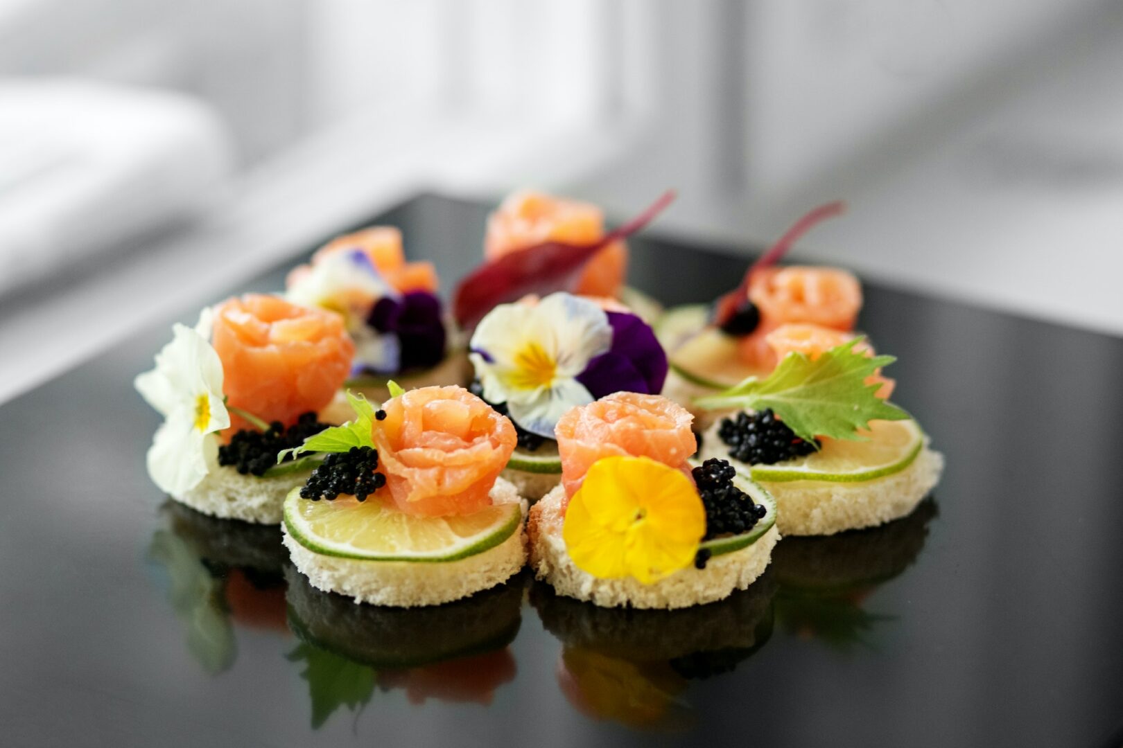 Delicious appetizer with salmon and edible flowers. Concept for food, restaurant, menu, catering