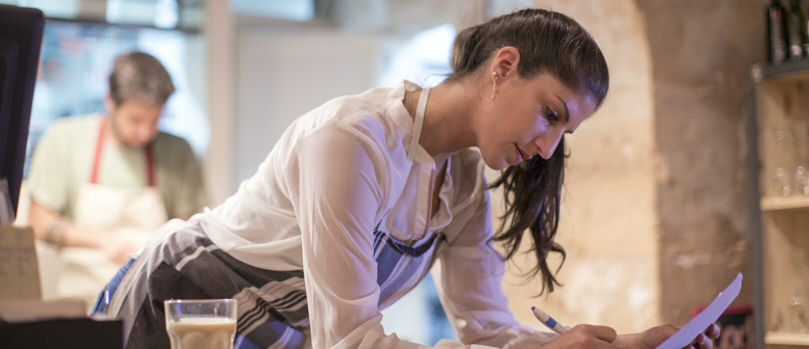 Restaurant owners working in kitchen