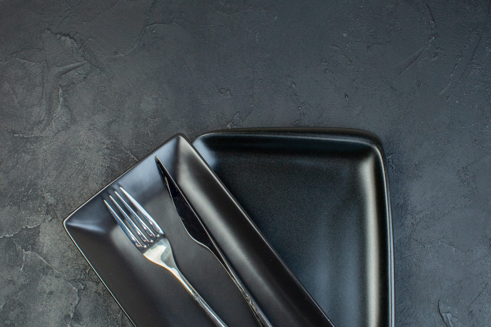 top view long black plates on dark background glass horizontal food restaurant colourful femininity