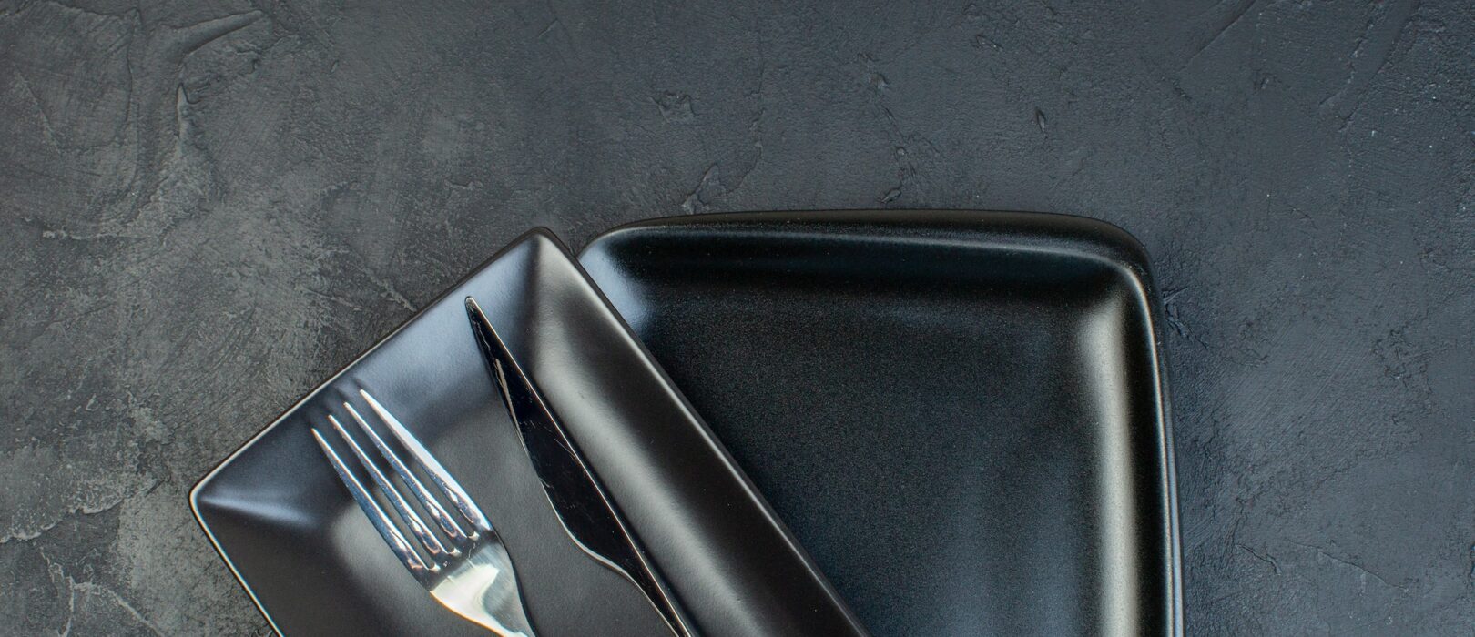 top view long black plates on dark background glass horizontal food restaurant colourful femininity